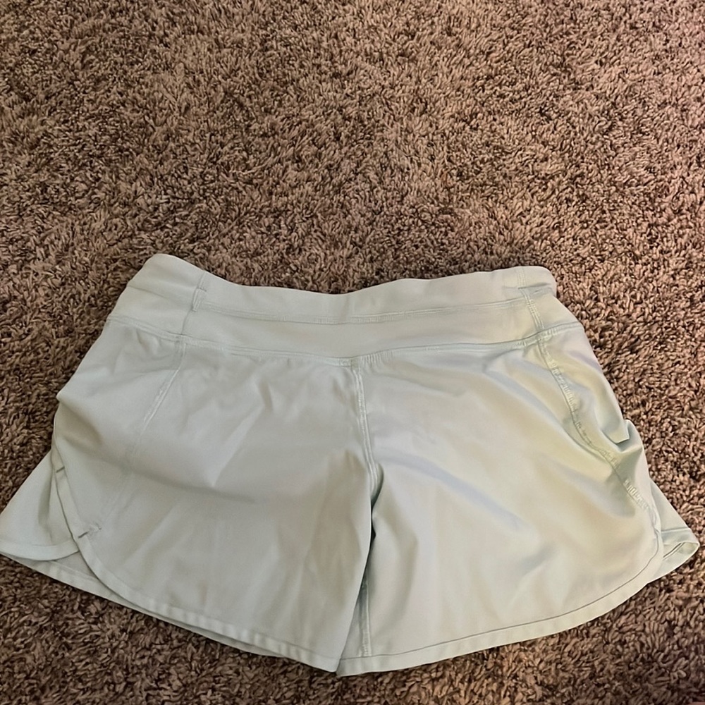 Size 2 mint/teal ivivva shorts 4”